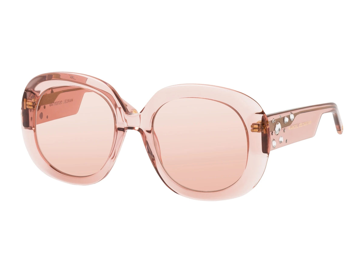 Marcel Ostertag Sonnenbrille Tiantang K13, transparente Fassung in Rose, runde Oversized-Gläser in Rose, Kristallstein-Verzierung am Bügel, Dreiviertelansicht.